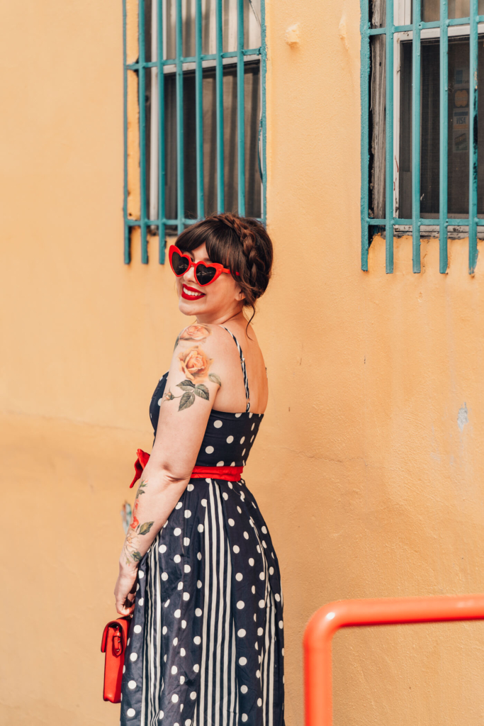 woman in polka dot dress for against the current