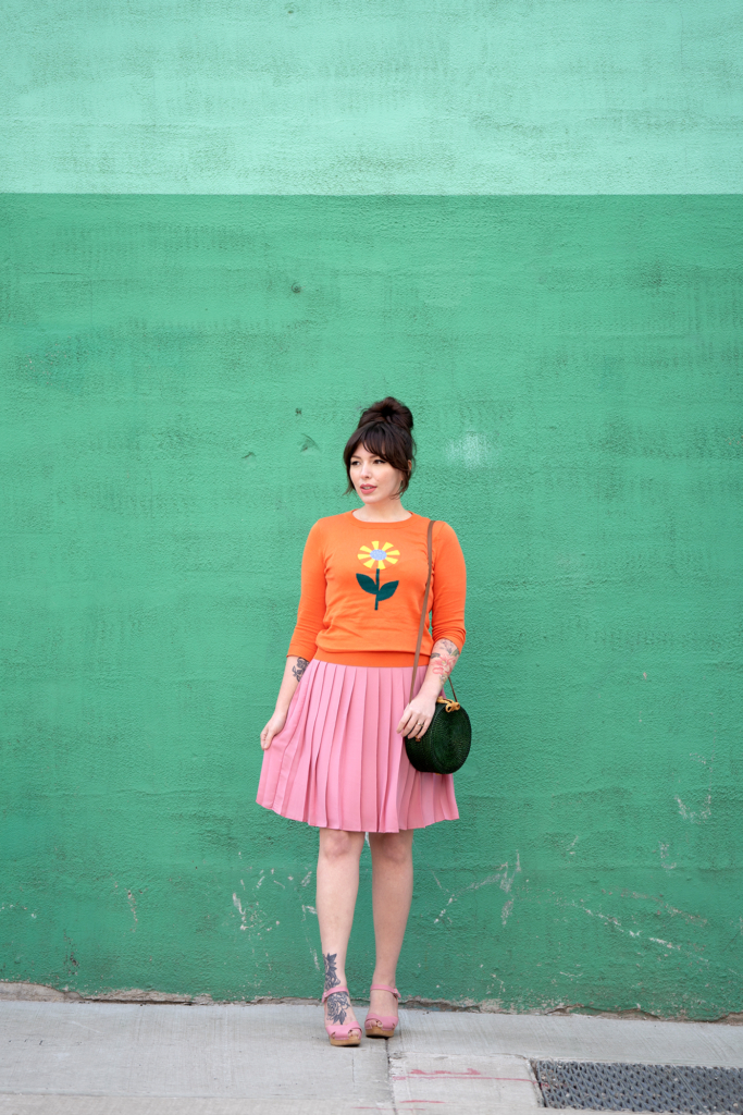 woman wearing modcloth pieces orange jacket and pink skirt