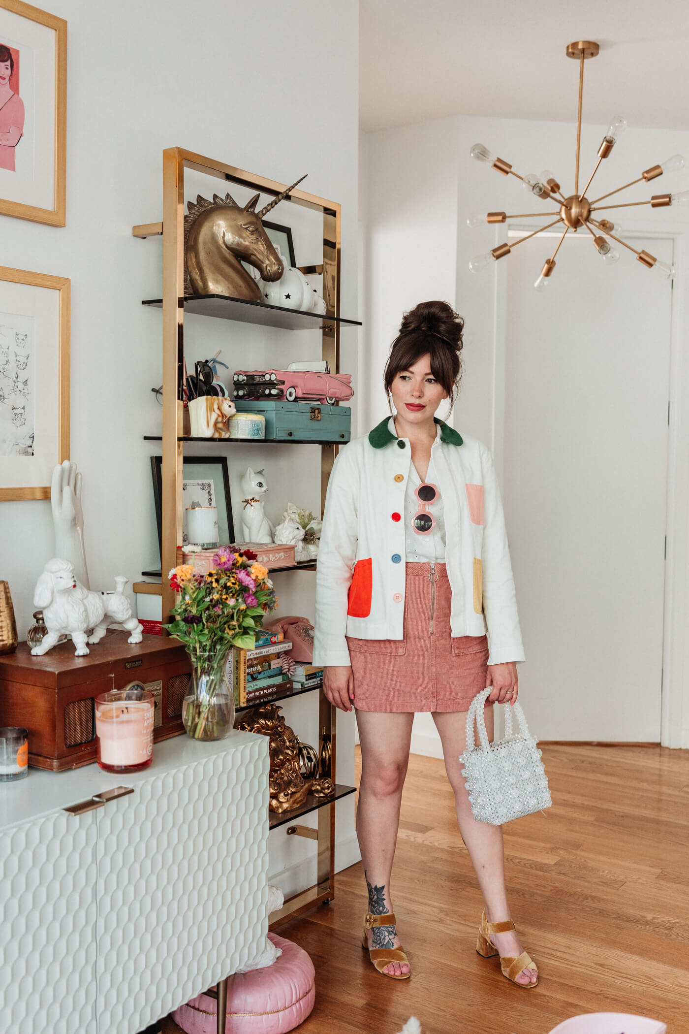 woman wearing white One Shirt 30 Ways and pink skirt