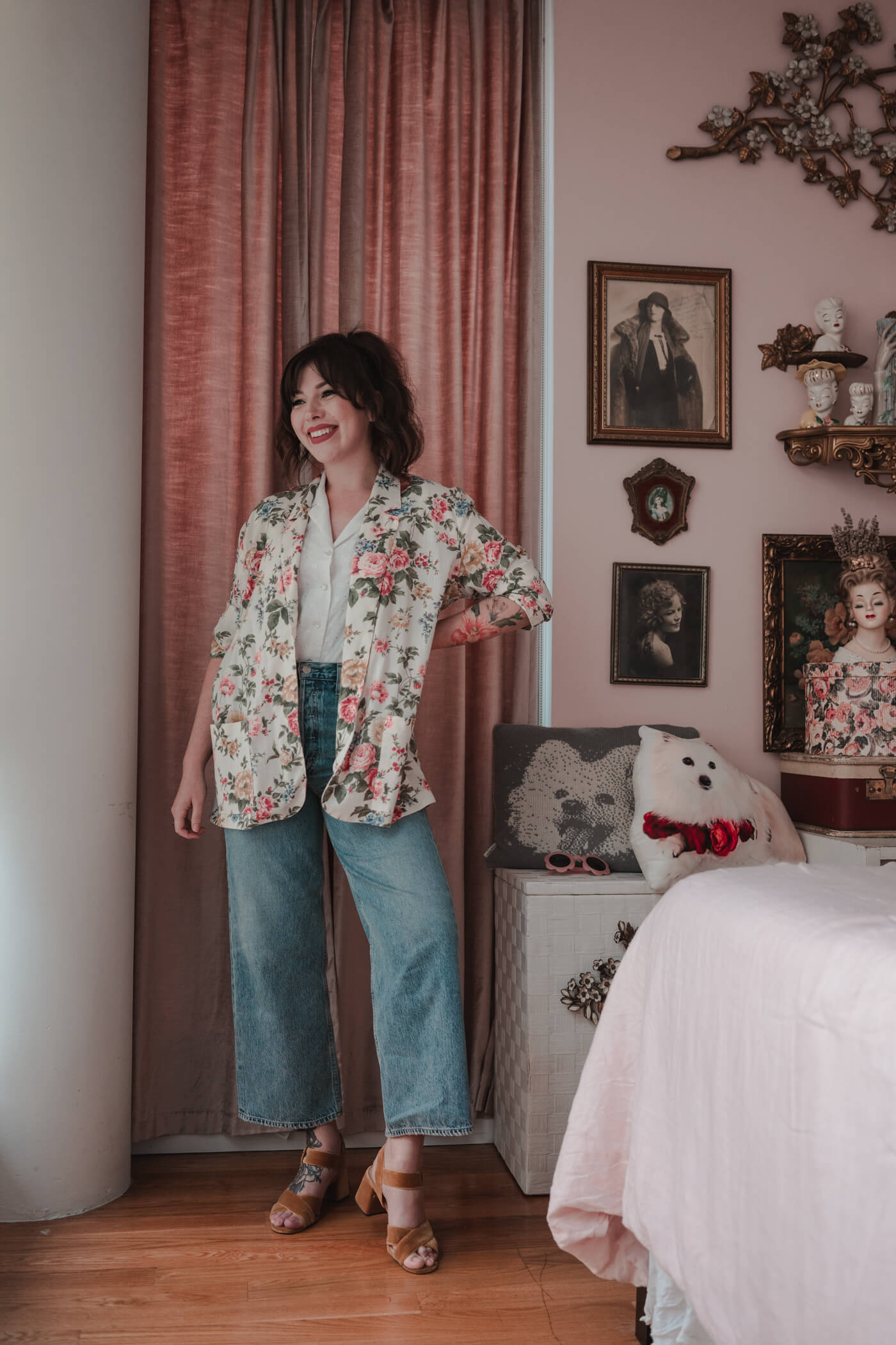 woman in her bedroom and wearing white shirt and denim jeans