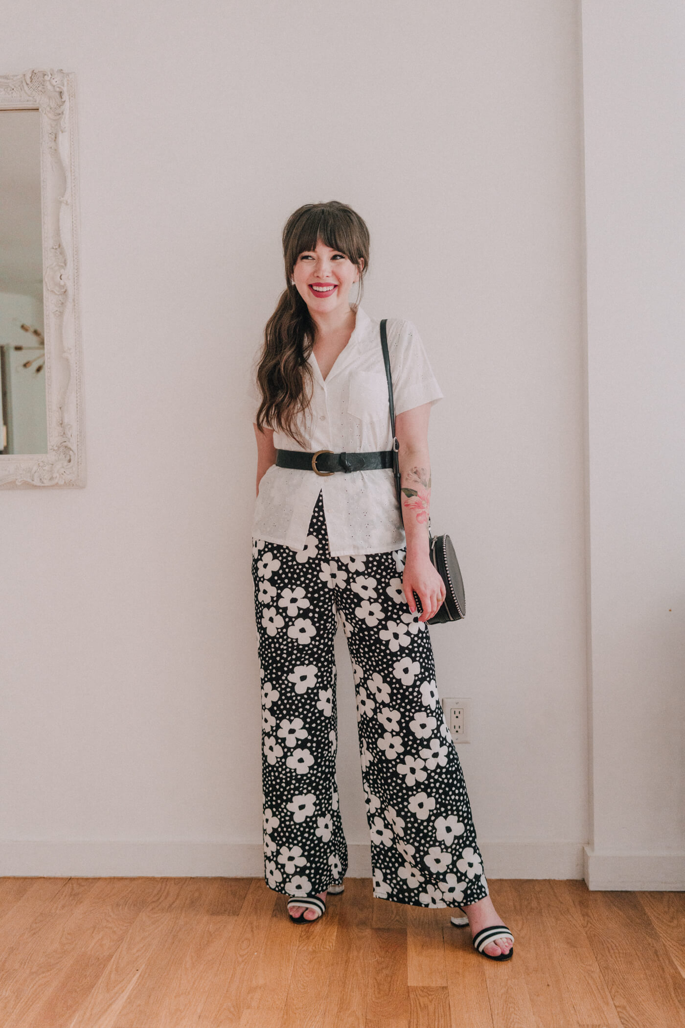 woman wearing white shirt and floral pants