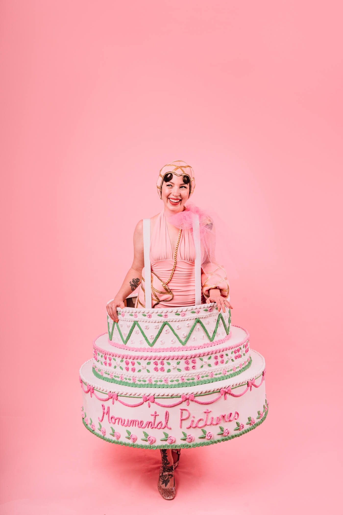 woman wearing a cake as a bottoms and smile