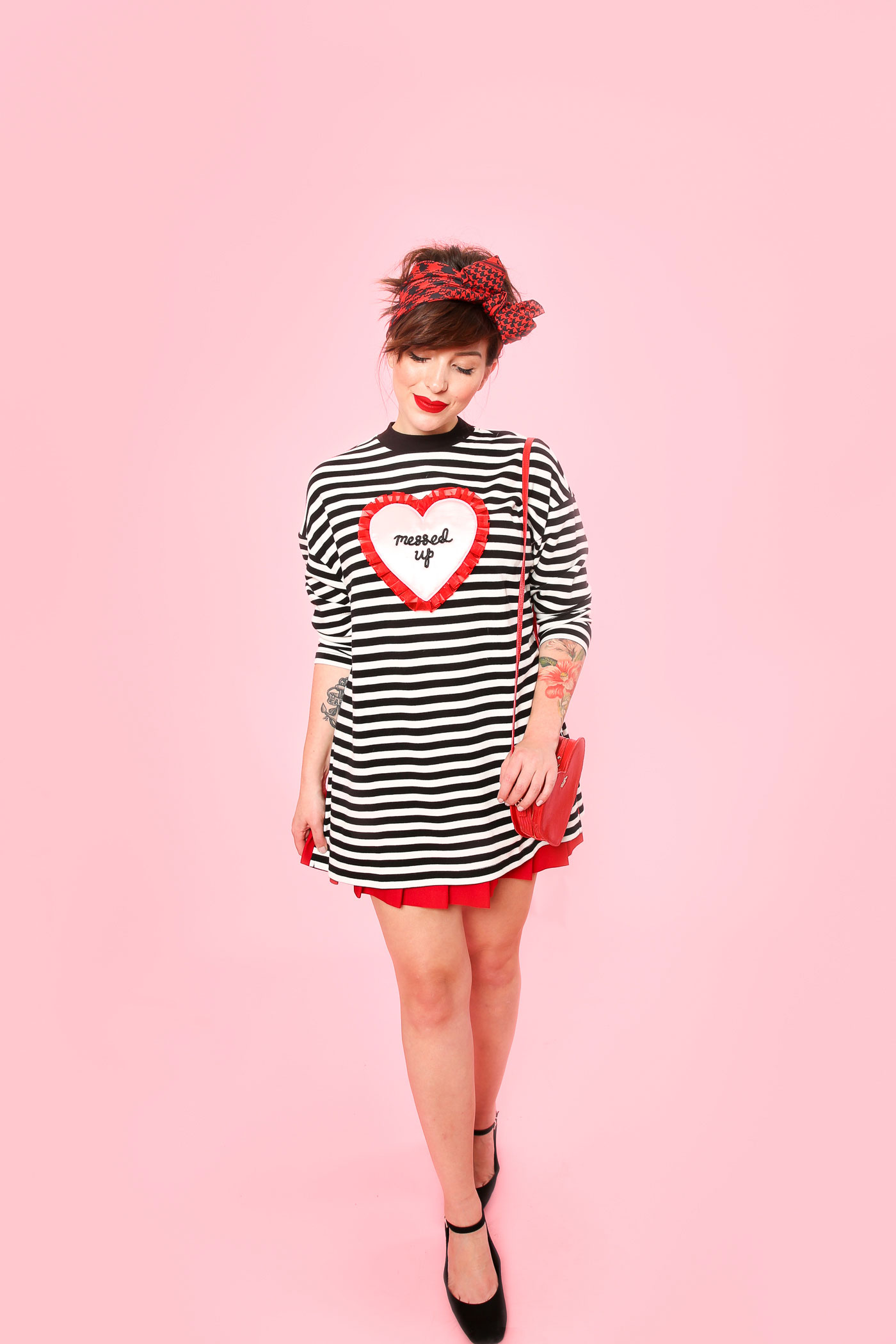 keiko lynn wearing lazy oaf oversized shirt and red skirt