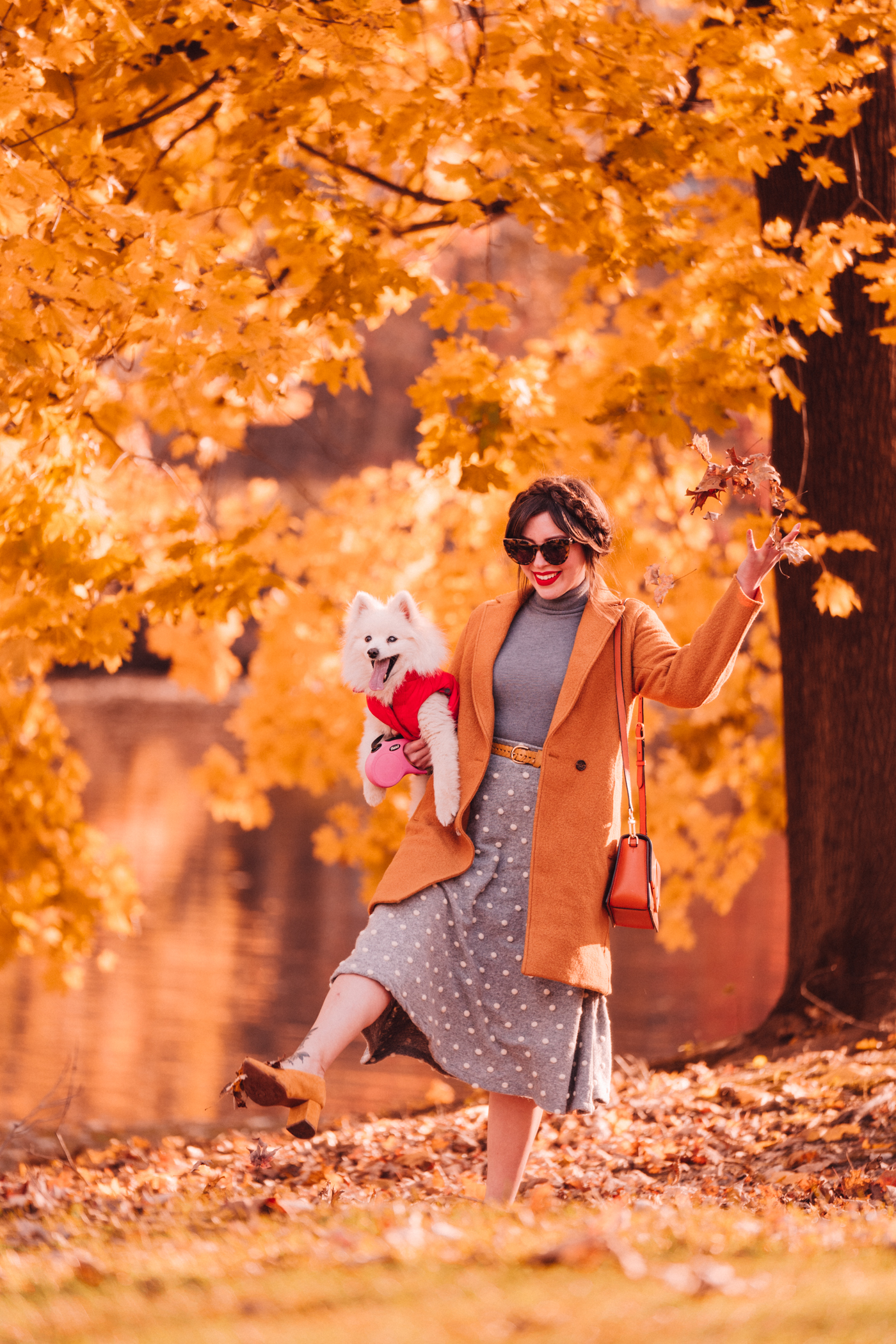woman with her dog in autumn