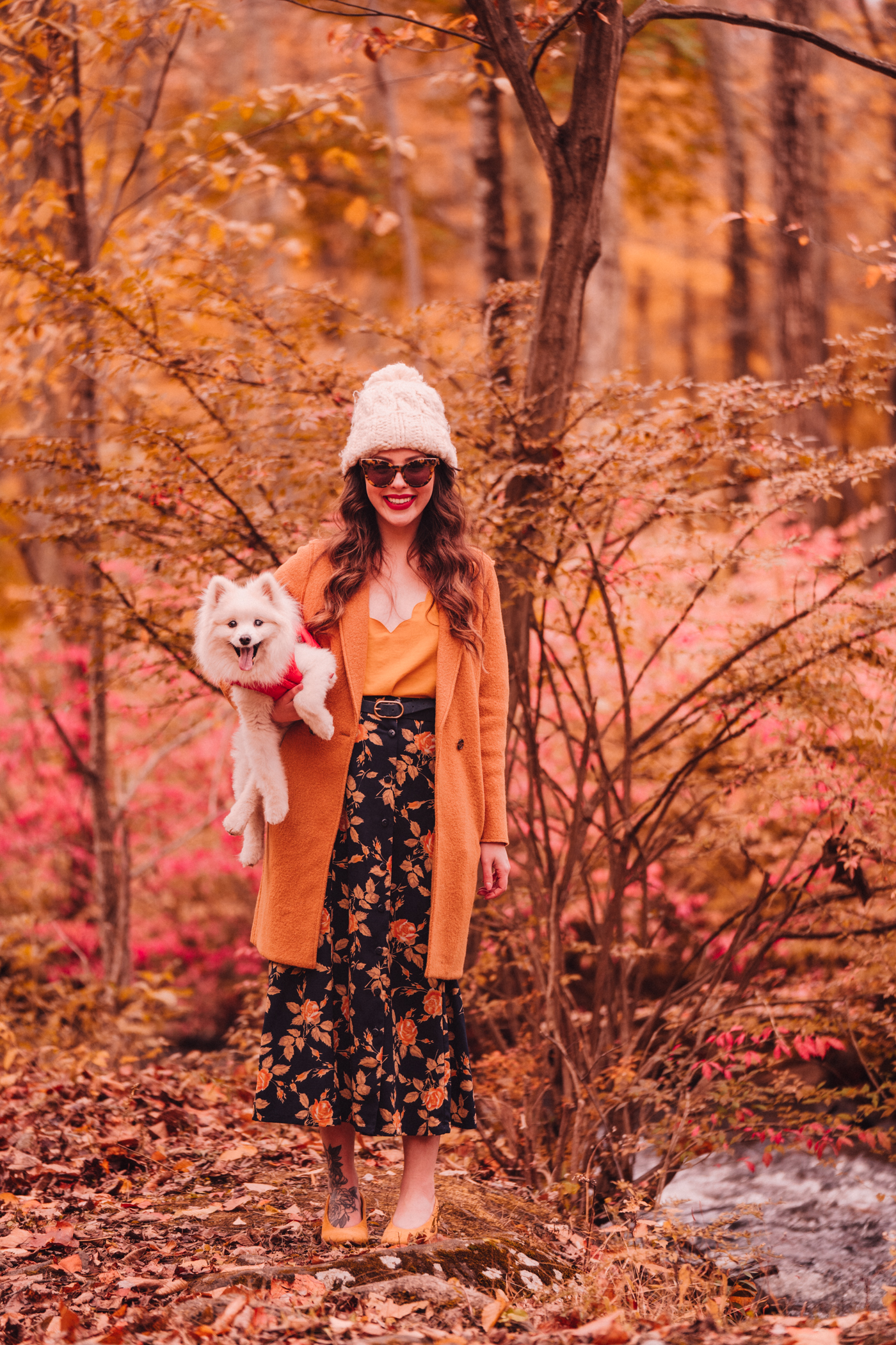 woman sharing Florals and Foliage and carrying her dog