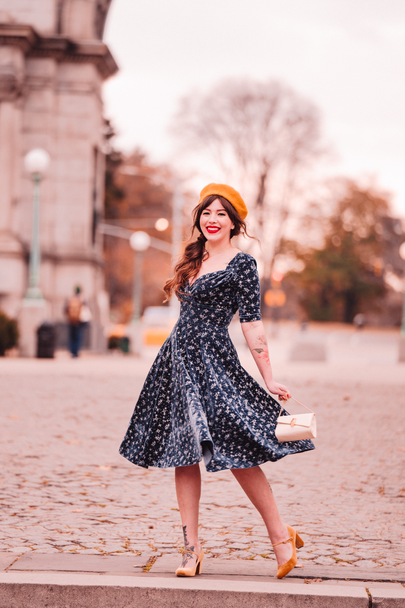 woman in blue dress and yellow hat for Blue Christmas