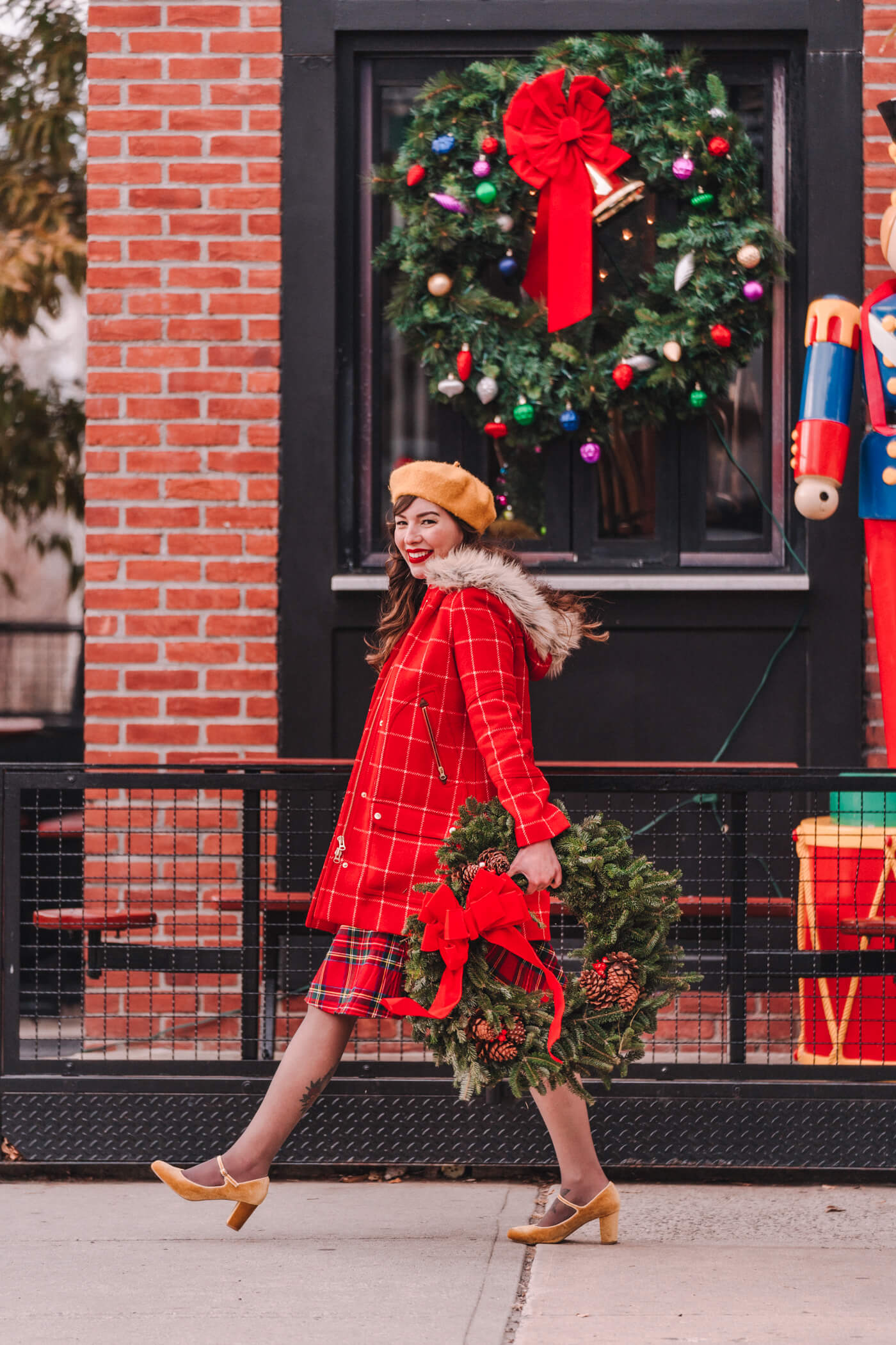 woman wearing Christmas plaid skirt modcloth holiday outfit for Shopping For Christmas Gifts