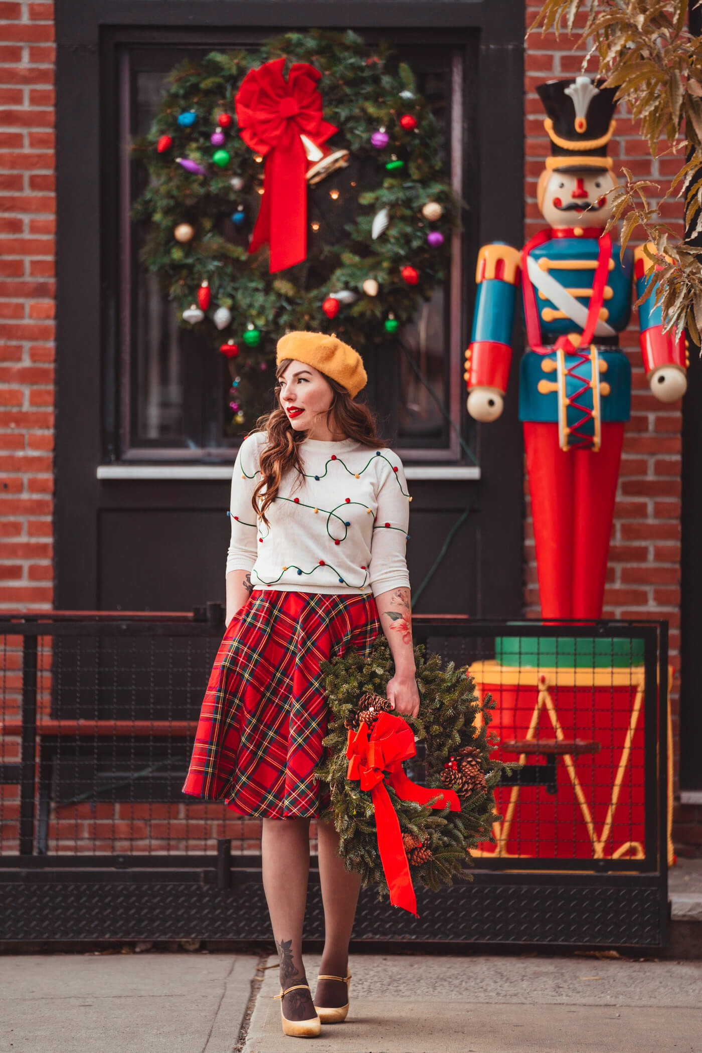 woman wearing plaid skirt modcloth holiday outfit for Shopping For Christmas Gifts