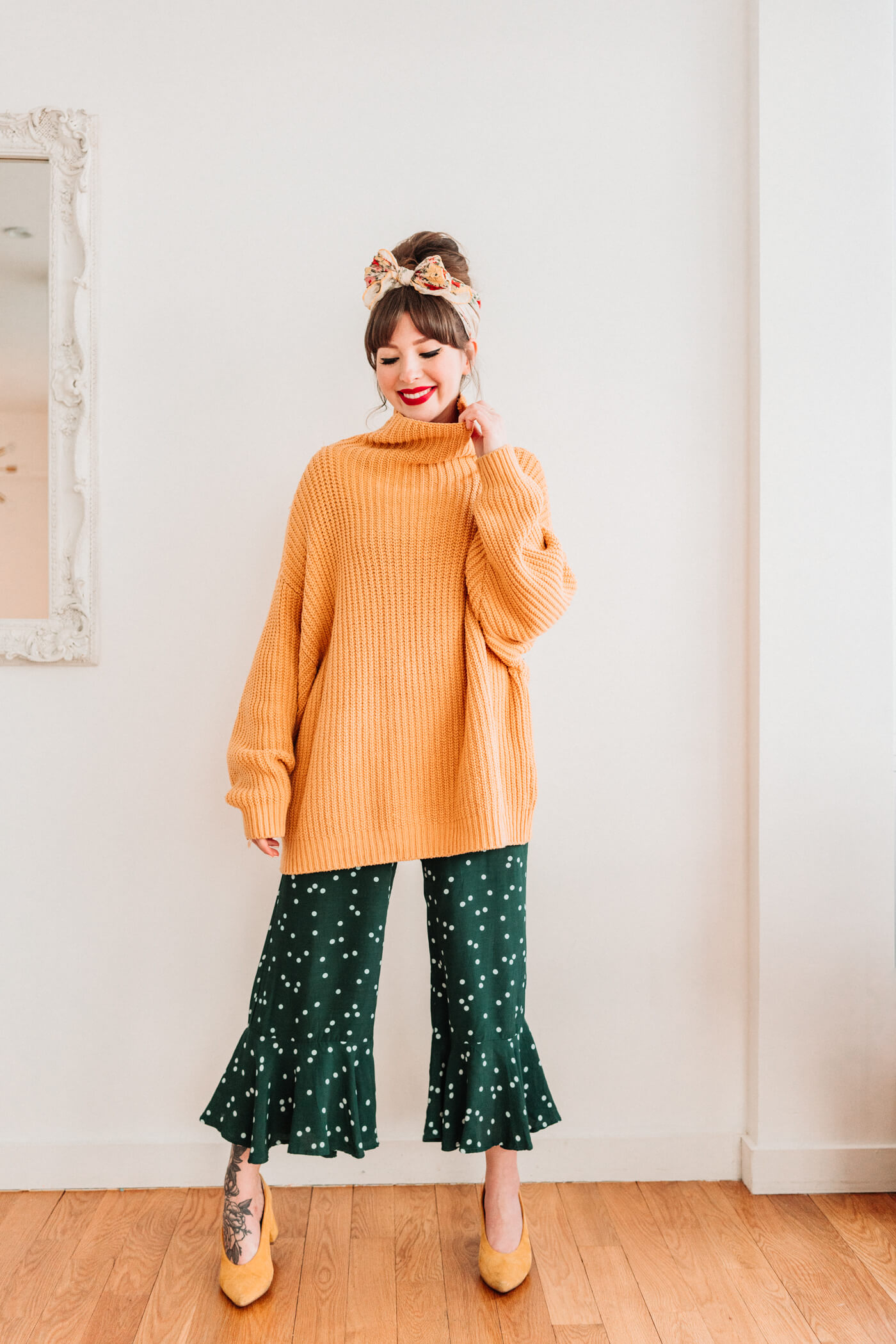 woman wearing green and polkadot with sweater 