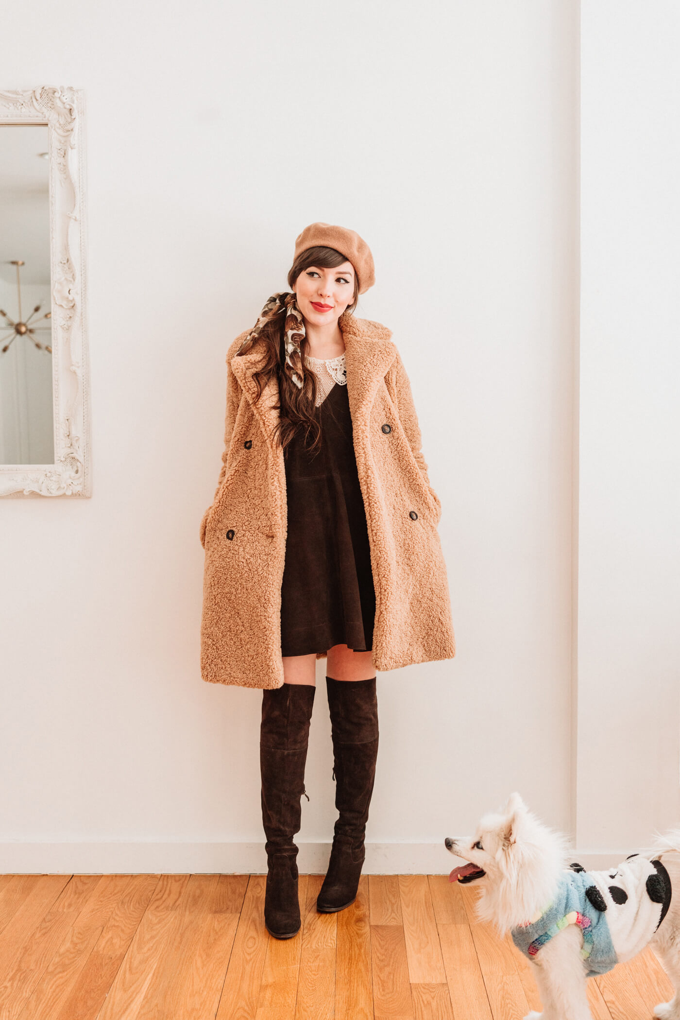 woman wearing teddy coat, brown dress and knee high boots 