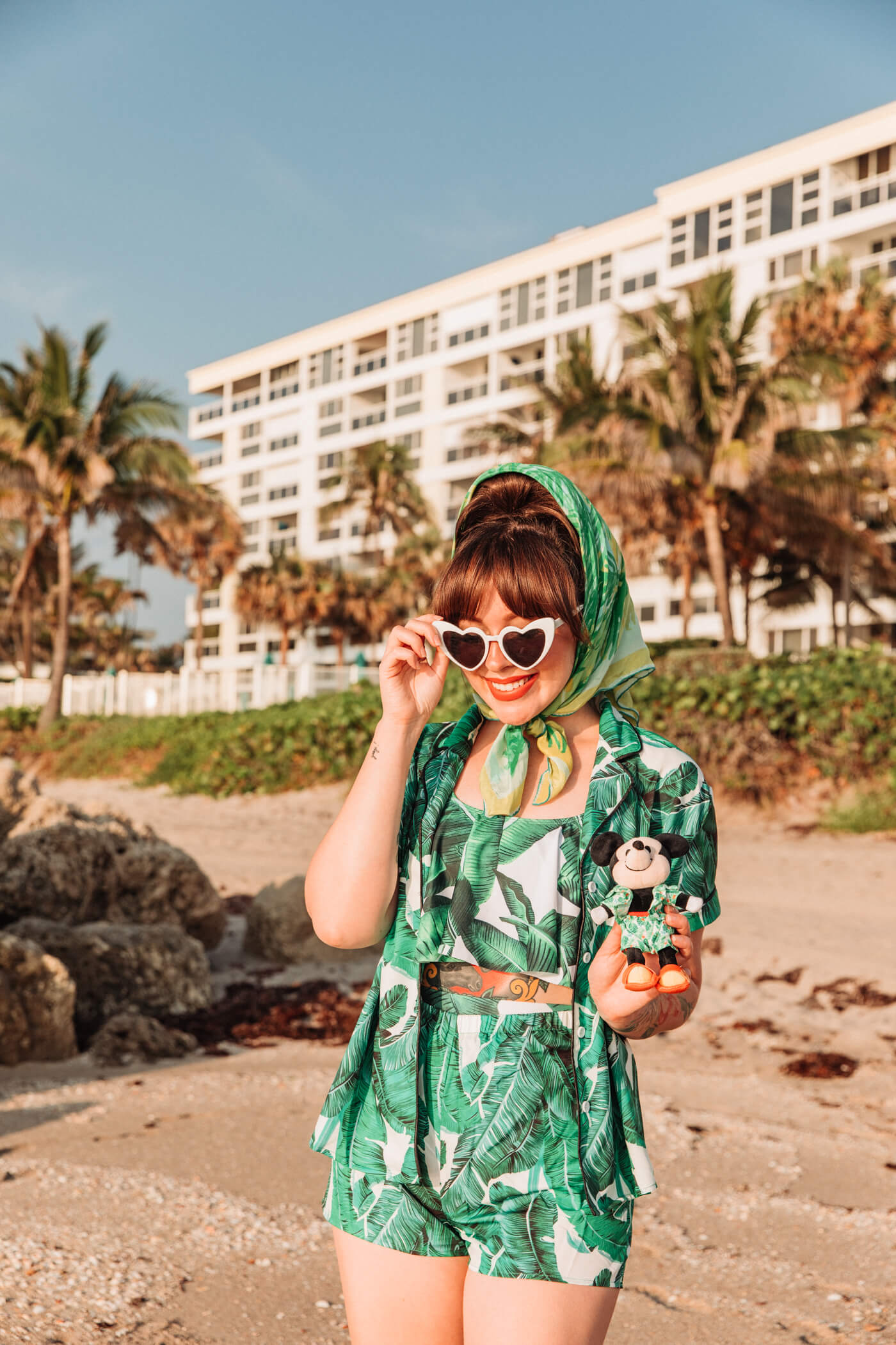 woman at the beach wearing green dress with leaves print for nuiMOs Outfits