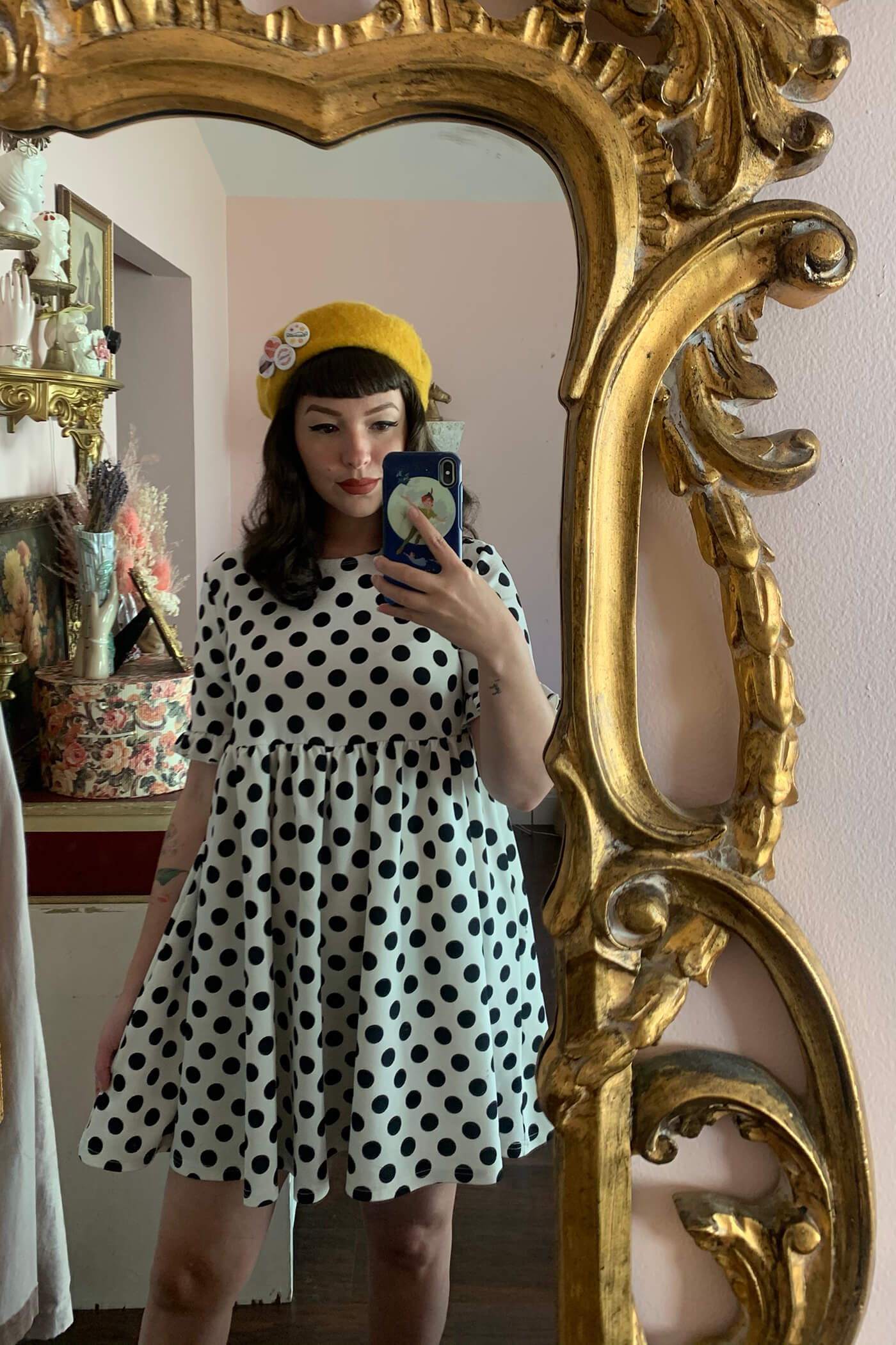 woman wearing yellow hat and polka dot dress for affordable clothing and accessory