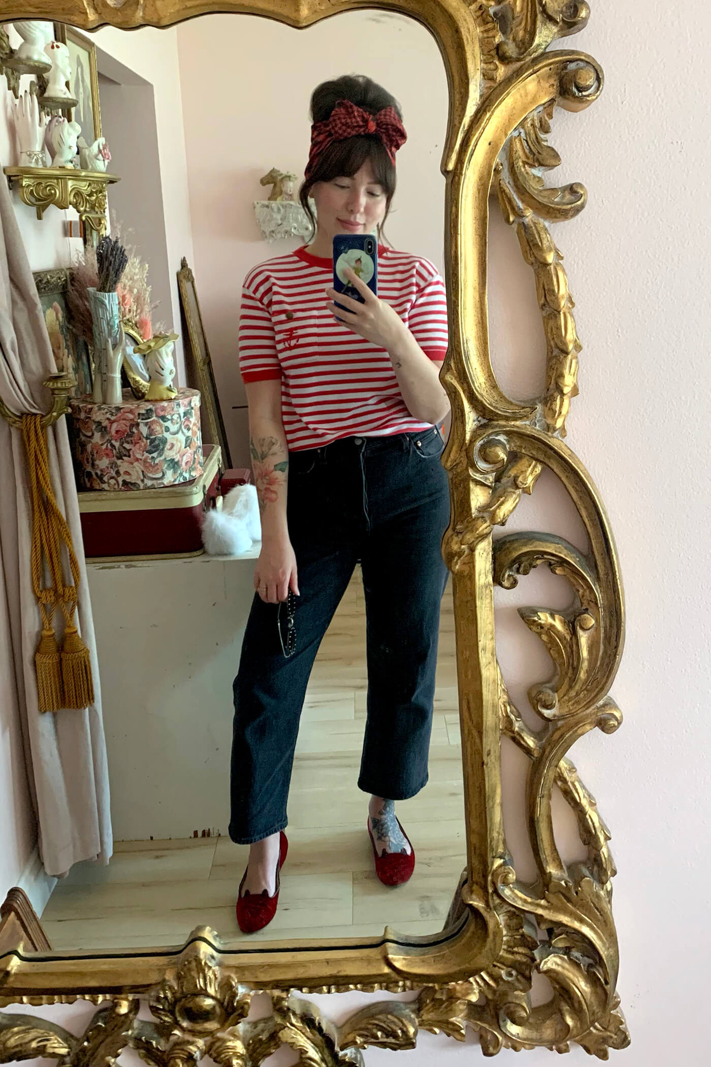 woman wearing red and white striped tshirt and one of her favorite brands and styles of jeans from Levi's