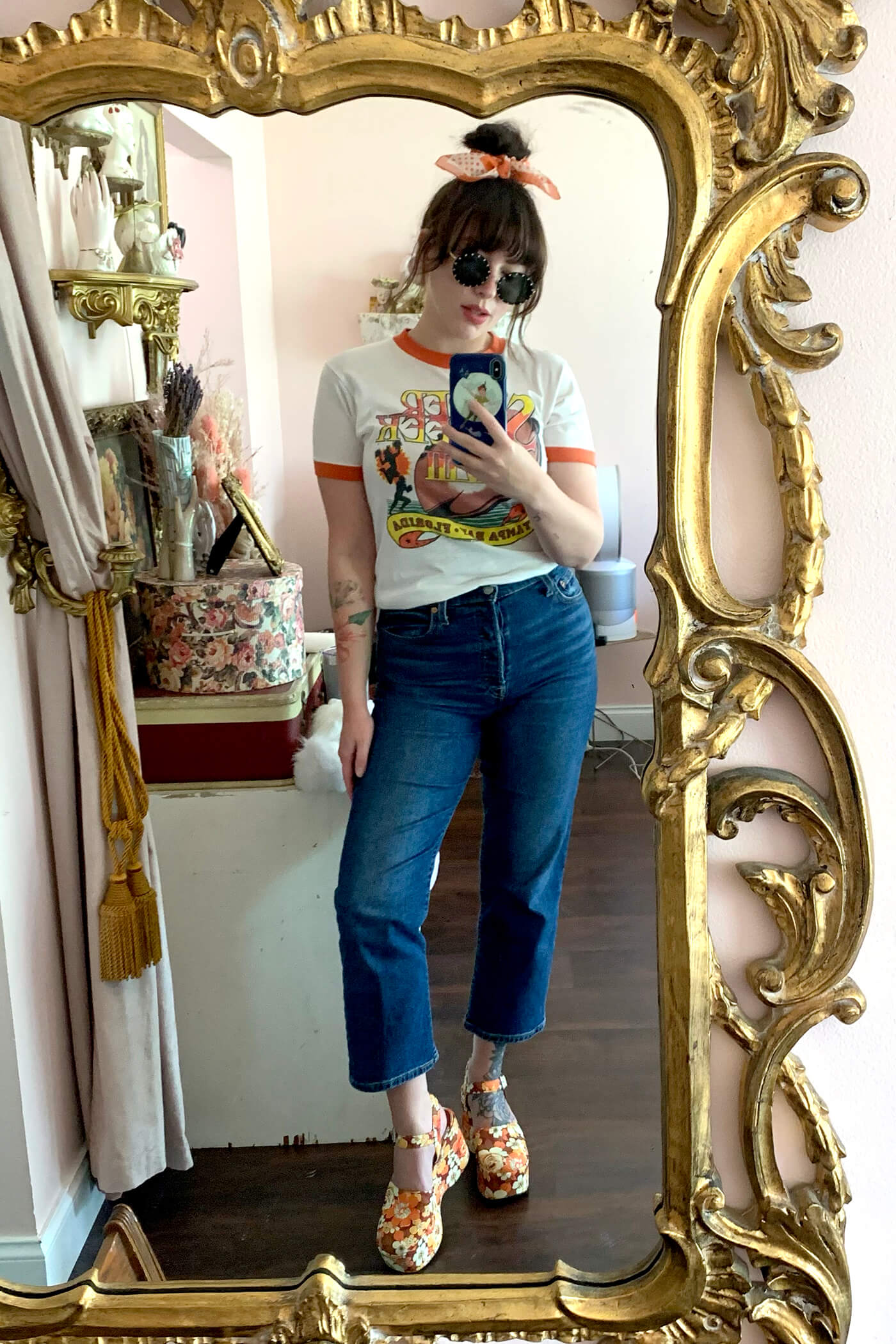 woman wearing tshirt and one of her favorite brands and styles of jeans from Levi's