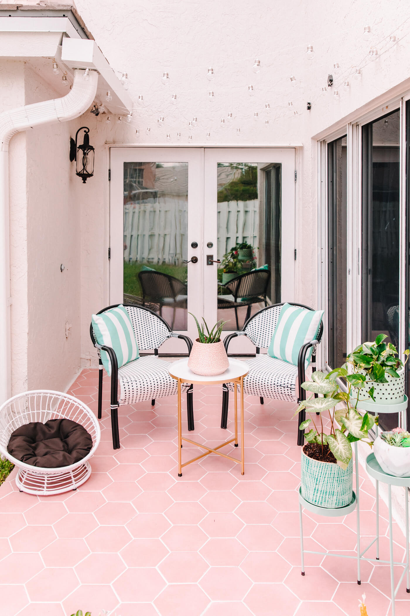 pastel patio decor ideas with pink tile and HomeGoods furniture