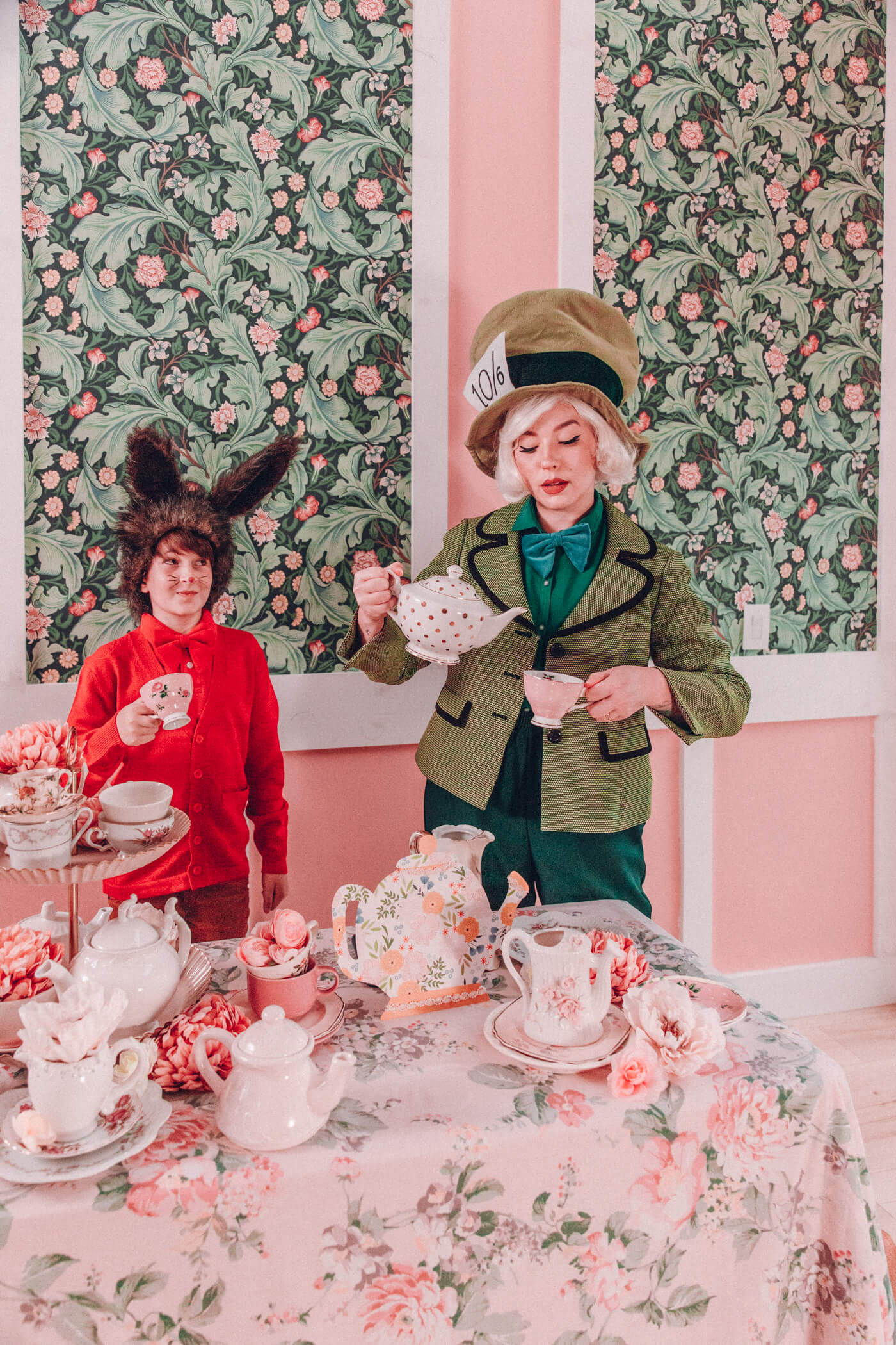 March Hare and Mad Hatter Costumes surrounded with tea setup