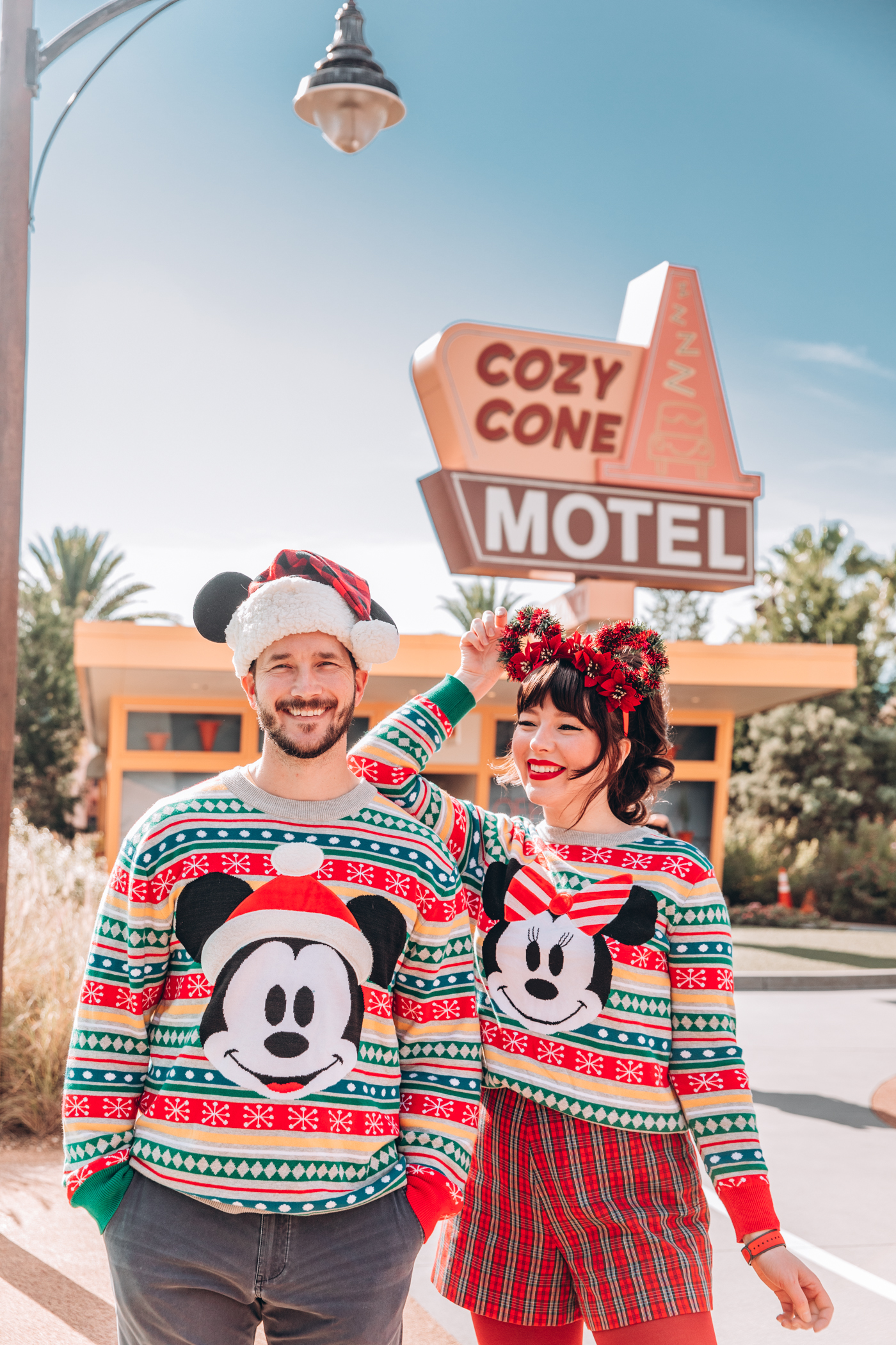 couple wearing holiday disney outfit 