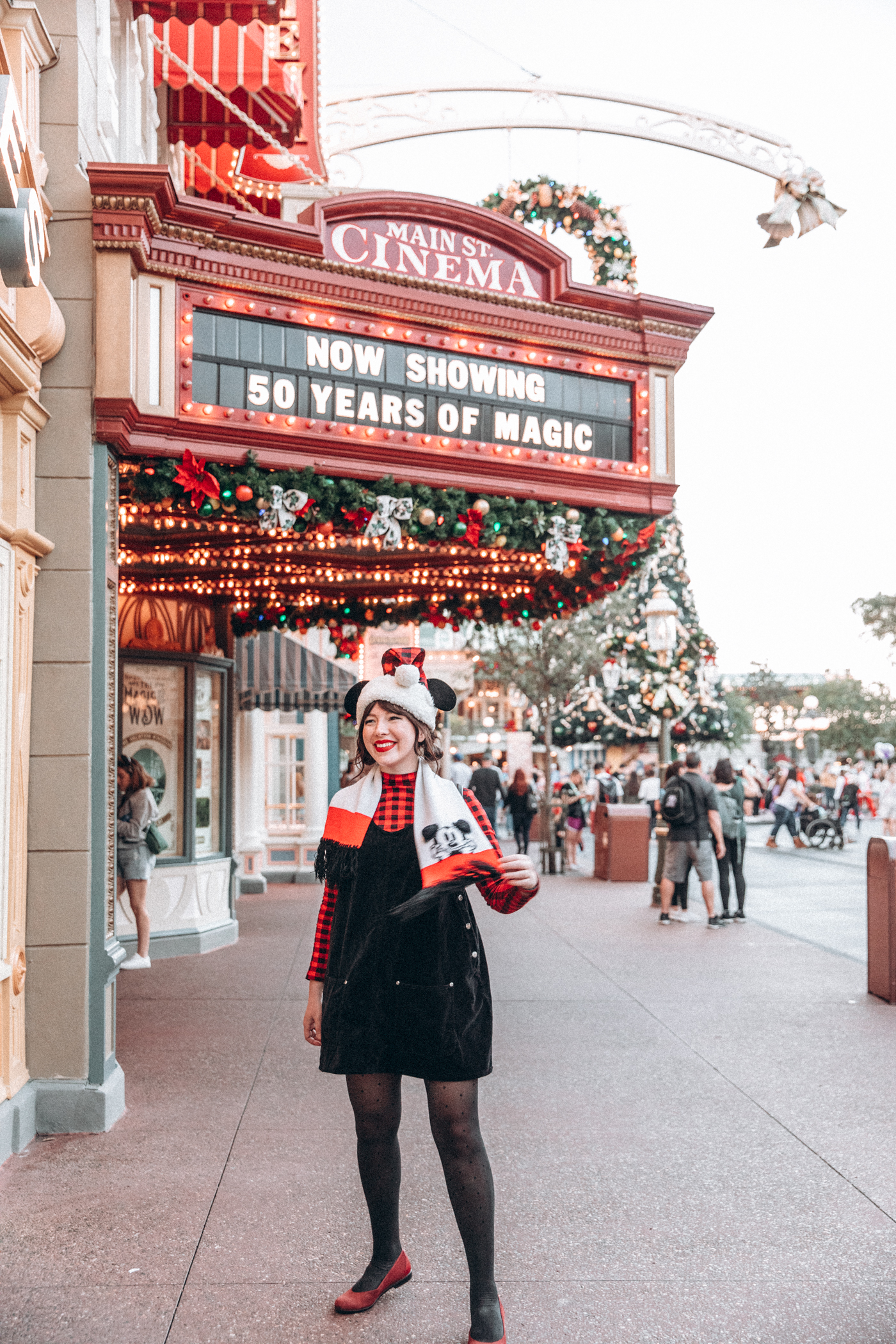 woman wearing in Disney sharing Holiday Disney Outfits