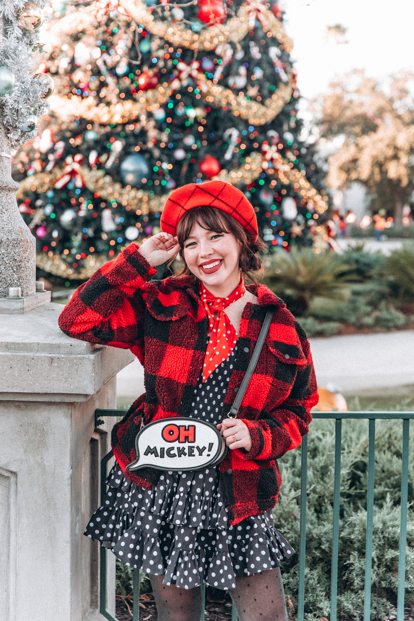woman in black and red outfit with Oh Mickey bag