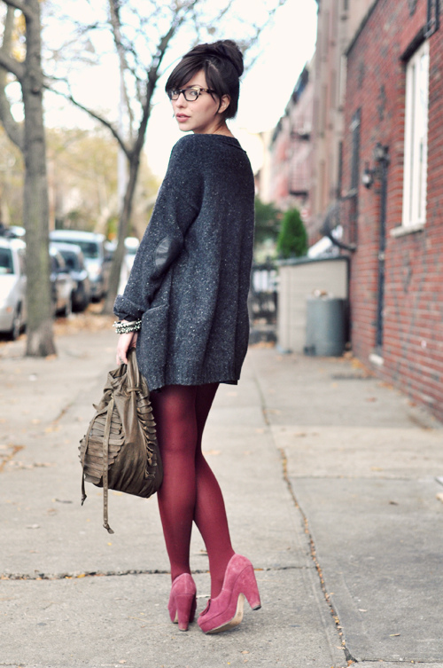 woman in red leggings and long sweater