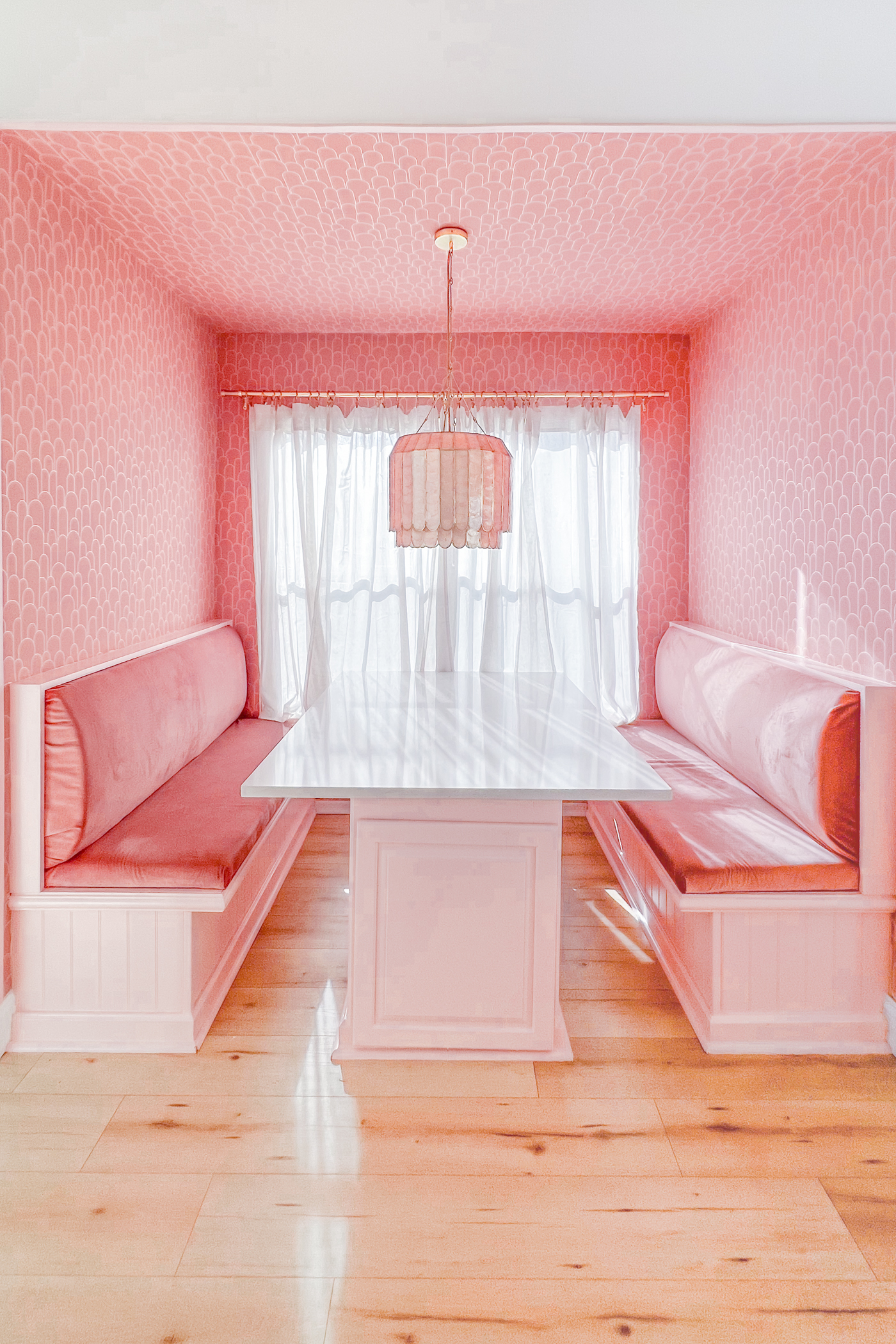 modern art deco inspired pink built in breakfast nook with storage benches by Keiko Lynn