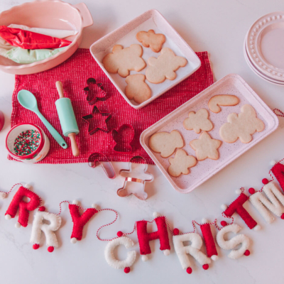 sugar cookie, cookie cutters, royal icing, and decor for a holiday party