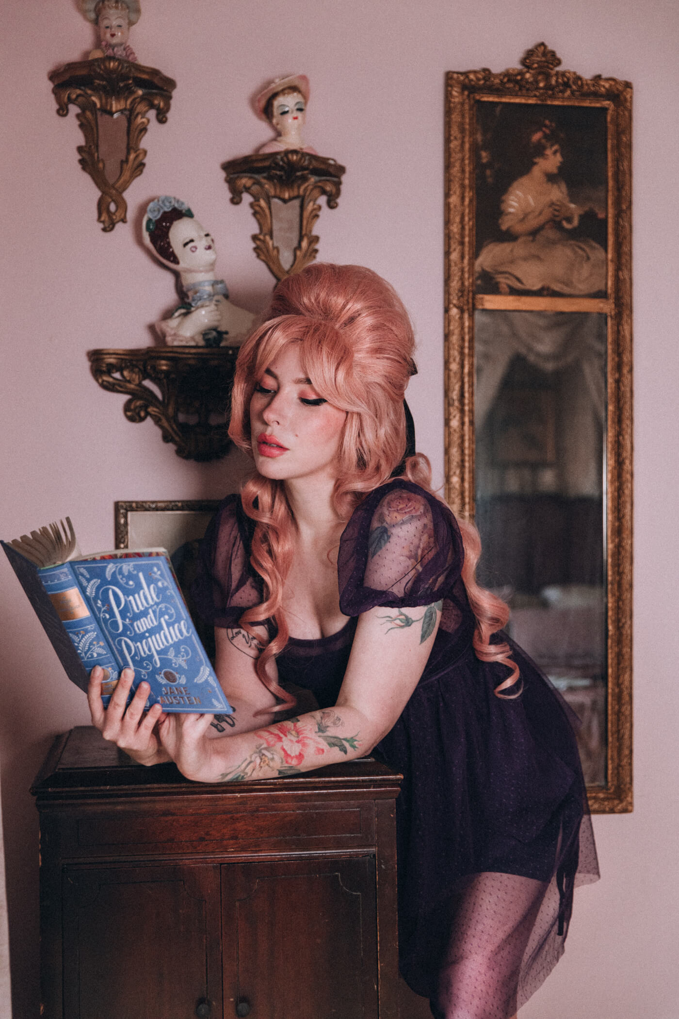 Keiko Lynn wearing a Most Ardently dress and reading Pride and Prejudice