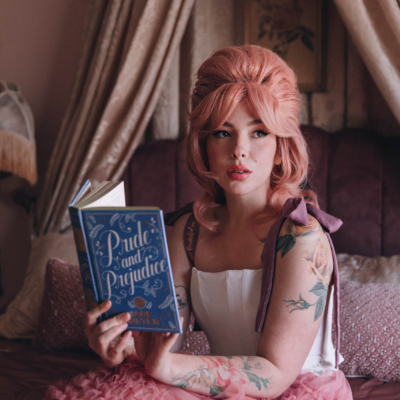 Keiko Lynn wearing a Most Ardently corset and reading Pride and Prejudice