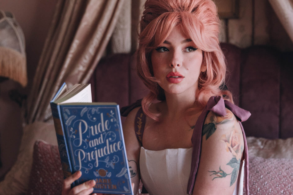 Keiko Lynn wearing a Most Ardently corset and reading Pride and Prejudice